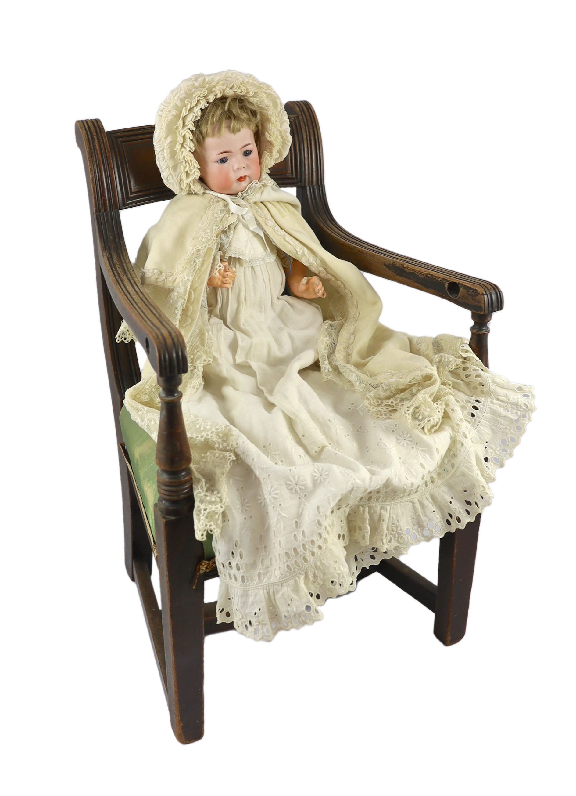 A Kammer & Reinhardt / Simon & Halbig bisque character doll, German, circa 1911, 16in. Please note the chair is for display purposes only.